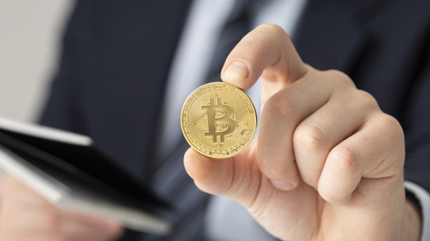 Man holding a bitcoin